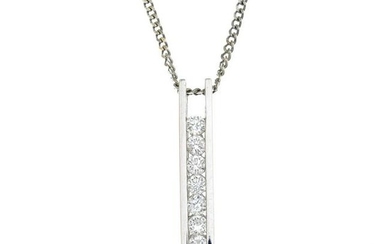 An 18ct gold diamond seven-stone pendant, suspended