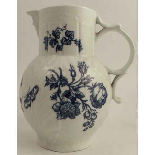 An 18th century Worcester blue and white porcelain mask spou...
