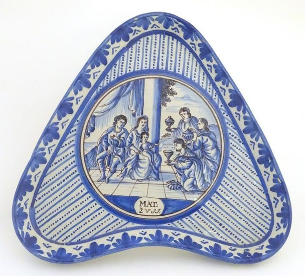 An 18thC blue and white Continental dish of triangular