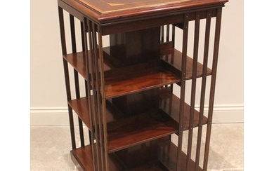 An Edwardian mahogany revolving bookcase, the square top inl...