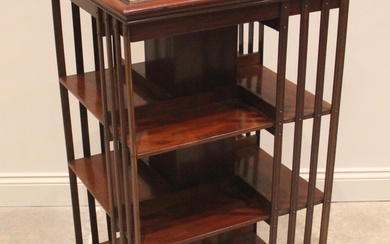 An Edwardian mahogany revolving bookcase, the square top inl...