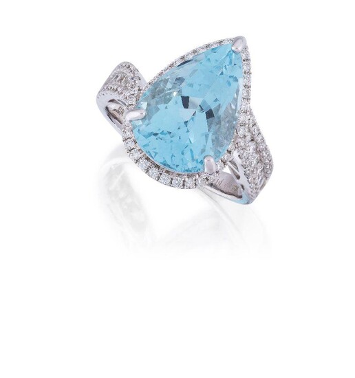 An aquamarine and diamond ring, the pear shaped aquamarine, weighing approximately 7.21 carats, to a brilliant-cut diamond surround and triple row crossover design shoulders, hoop signed David Jerome, mounted in 18ct white gold, Birmingham...