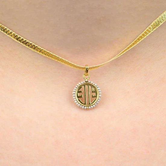 An early 20th century 18ct gold seed pearl pendant