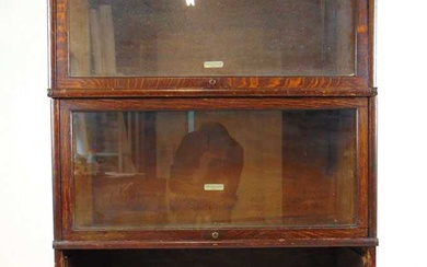 An early 20th century oak sectional bookcase by Globe-Wernicke &...