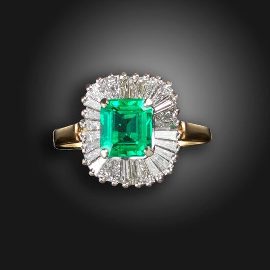 An emerald and diamond ballerina ring, the emerald-cut emerald weighs...