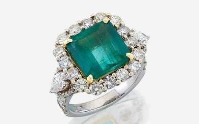 An emerald, diamond, and eighteen karat white gold ring
