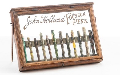 Antique oak Fountain Pen Display for "John Holland", in original finish, contains 12 vintage pens