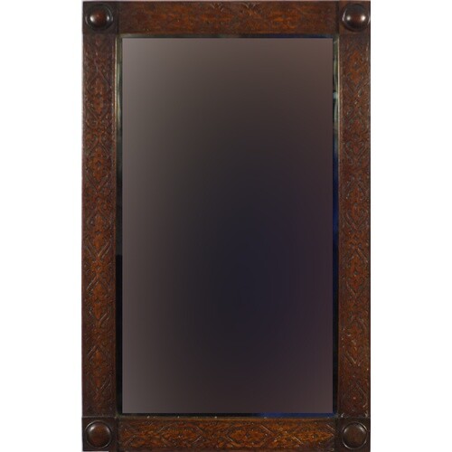 Arts & Crafts carved oak wall mirror with bevelled glass, 79...