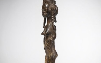 BAOULE, Ivory Coast. Beautiful feminine sculpture adorned with...