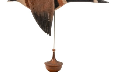 CANADA GOOSE WEATHER VANE In the style of A.E. Crowell. Includes urn-turned base. Height 29". Length 29".