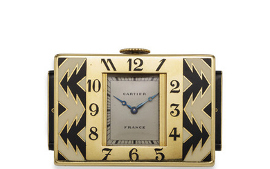 CARTIER, A VERY FINE AND RARE 18K YELLOW GOLD AND ENAMEL “SHUTTER” TRAVEL CLOCK