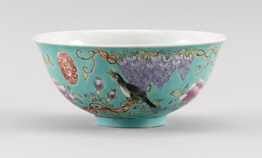 CHINESE FAMILLE ROSE PORCELAIN BOWL Decoration of a bird in a peony tree under a wisteria vine on a turquoise blue ground. Inscripti...