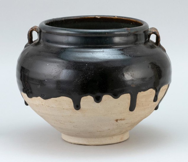 CHINESE HENAN GLAZE POTTERY JAR In ovoid form, with two applied handles and a rich black-brown drip glaze. Diameter 9.25".