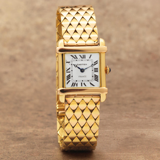 Cartier. An 18K gold manual wind bracelet watch Tank Chinoise,...