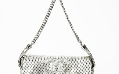 Chanel: A bag of metallic silver perforated coloured leather with silver tone hardware and a short handle on the bottom. – Bruun Rasmussen Auctioneers of Fine Art