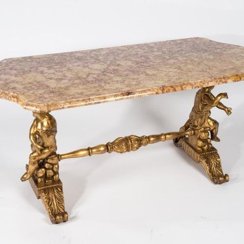Coffee table in metal and gilded wood with two putti...