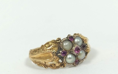 Early Victorian garnet and pearl ring in engraved gold, prob...