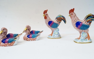 Four Herend porcelain animal figures, 20th century, comprising: a cockerel, with red fishnet design, having blue printed mark HEREND HUNGARY HANDPAINTED and impressed HEREND 5031 10, 13.8cm high; another similar cockerel, with blue printed marks...