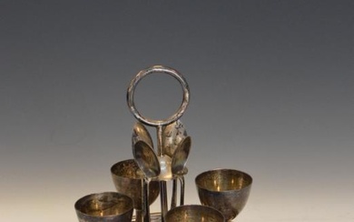 George V silver four-egg cruet comprising: four egg cups,...