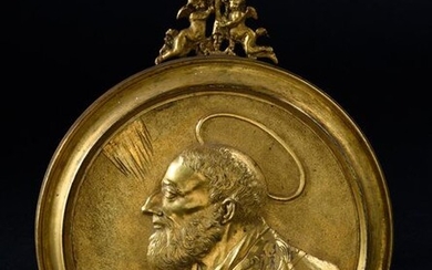 Gilded bronze plaque with a figure of a Saint in bust in left profile.