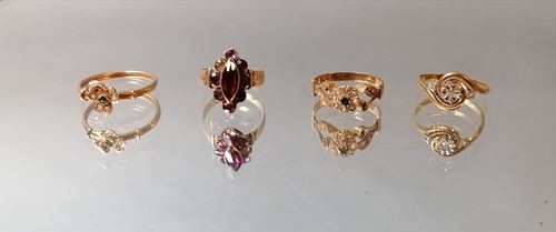 Gold ring sets including a marquise ring decorated...