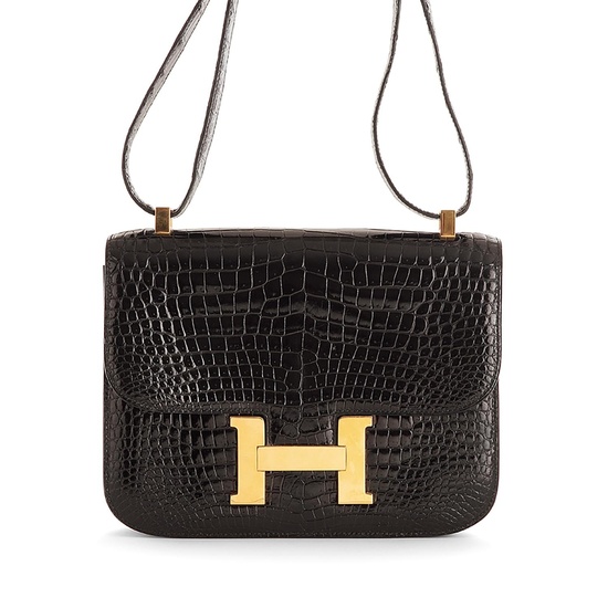 #HERMÈS PARIS ANNÈE 1988 Constance handbag in black crocodile leather Hardware in gilt metalHandle in crocodile leatherLining in bla...