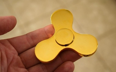 High Society GOLD PLATED FIDGET SPINNER over solid