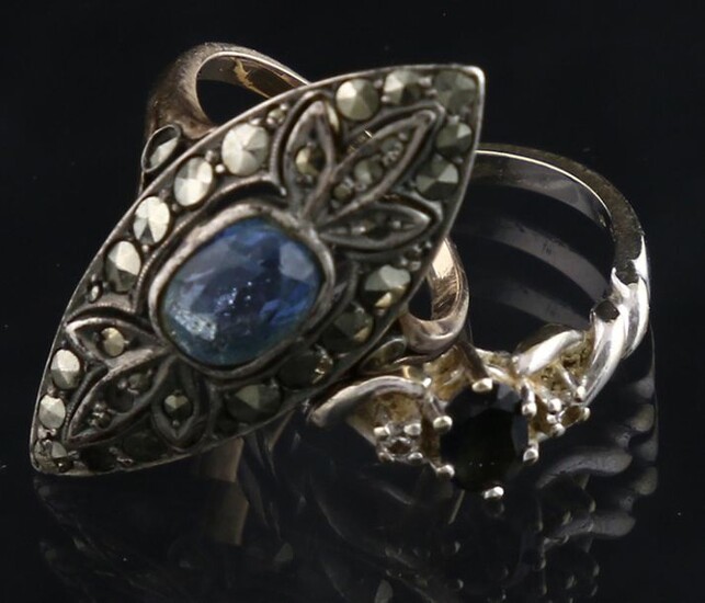 Jewellery gold - 14k yellow gold and silver navette ring set with a blue paste stone and marcasites - some marcasites missing, 52 mm - and a 14k white gold ring set with an oval-cut sapphire and two single-cut diamonds - 53 mm