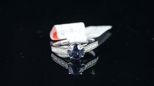 NEW OLD STOCK, Sapphire and diamond ring, round cut sapphire estimated weight 1.69ct, diamond set shoulders, estimated total...