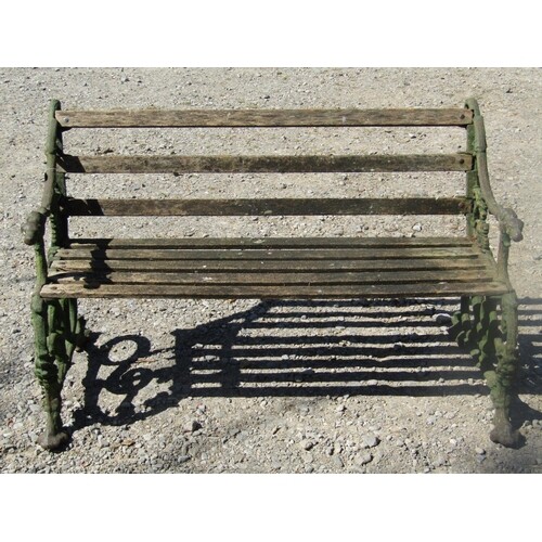Old cast iron timber and garden bench, the ends with hound a...