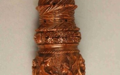 PIPE RING made of corozo nut carved with three winged figures and rinceaux. Removable foliated lid. Beginning of the XIXth century. Height : 13 cm