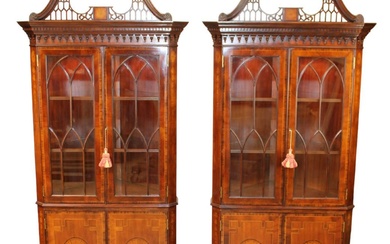 Pair Lloyd Buxton Chippendale style mahogany corner cabinets