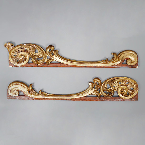 Pair of Rococo finishings in carved, marbled and gilt wood, 18th Century.