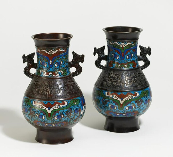 Pair of bronze vases with taotie masks and dragons