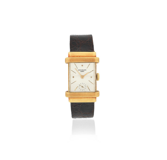 Patek Philippe. An 18K gold manual wind rectangular wristwatch with hooded lugs