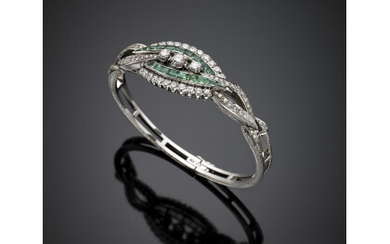 Round diamond and calibré emerald white gold cuff bracelet, diamonds in all ct. 8 circa emeralds in all ct. 3.50…Read more