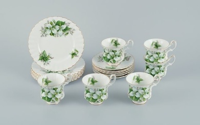 Royal Albert, England. A set of six "Trillium" coffee cups with saucers and cake plates. Decorated