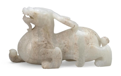 STRIATED TRANSLUCENT WHITE JADE CARVING OF A QILIN...