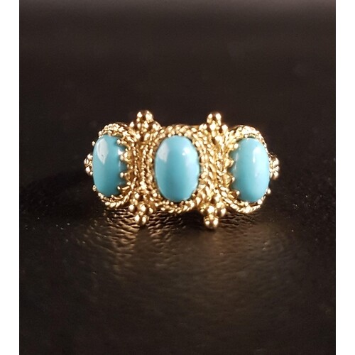TURQUOISE THREE STONE RING the three oval cabochon turquoise...
