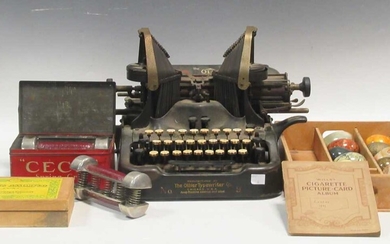 'The Oliver typewriter No.9', a pair of Cecil spring grip dumbells in the orginal tin box, cigarette