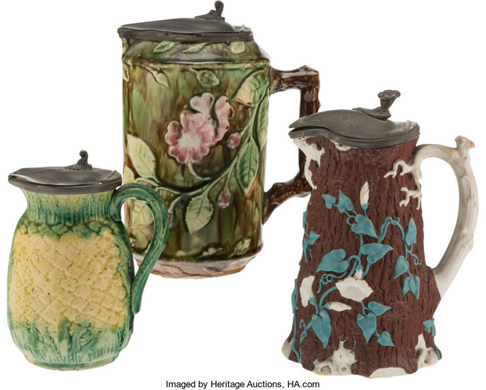 Three Majolica Pitchers with Covers
