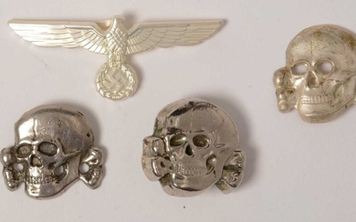 Three reproduction WWII SS Toten Kopf badges and a cap badge