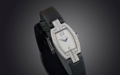 Tiffany & Co, montre-bracelet pour dame en or et diamants, cadran signé avec index arabes...