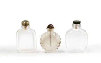 Two Chinese rock crystal snuff bottles and one translucent glass imitating crystal...