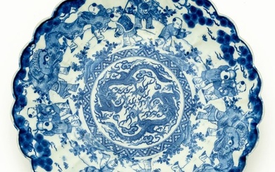 VERY LARGE CHINESE BLUE AND WHITE PORCELAIN PLATE WITH FIGURAL SCENES AND MYTHICAL CREATURES