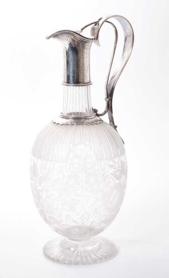 Victorian cut glass claret jug of bulbous form, with etched floral decoration and star cut base, floral engraved silver plated collar, with integral handle and sprung hinged cover. 29.5cm overall h...