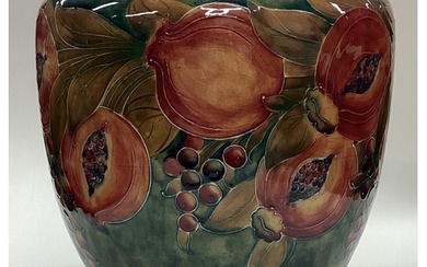 WILLIAM MOORCROFT: An early "Pomegranate" bowl on mottled gr...