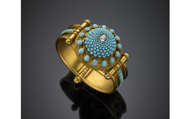 Yellow gold Retro cuff bracelet with a dome central of graduated cabochon turquoise terminating with a cushion diamond, finely wrought…Read more