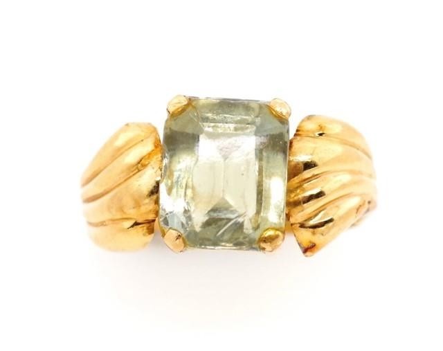 Yellow gold and green gemstone cocktail ring rubbed marks. A...