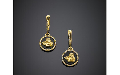 Yellow gold and onyx cupid pendant earrings accented with colourless stones, g 9.21, length cm 3.2, diam. cm 1.4 circa.…Read more